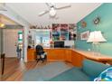 Craft room with built-in workspace and teal walls at 1341 Perico Point Cir # 116, Bradenton, FL 34209