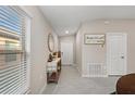 Bright and airy entryway with tile floors and a console table at 15304 Miller Creek Dr, Sun City Center, FL 33573