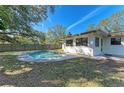 Inviting kidney-shaped pool in the backyard at 1625 Bravo Dr, Clearwater, FL 33764