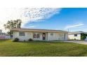 Ranch-style home with a spacious front yard at 1778 Palm Dr, Venice, FL 34293