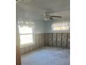 Unfinished bedroom with exposed studs and flooring at 211 84Th St, Holmes Beach, FL 34217