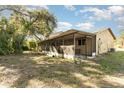 Large screened porch with patio furniture at 288 Ambler St, Port Charlotte, FL 33954