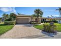Brick house with a brown double door and a paved driveway at 4503 Coral Lake Dr, Bradenton, FL 34210