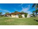 Single story home with a fenced backyard and lush landscaping at 6405 Auburn Ave # 8, Bradenton, FL 34207