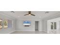 Bright and airy living room with tile floors and built-in entertainment center at 6429 Hollywood Blvd, Sarasota, FL 34231