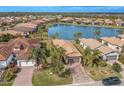 Aerial view of a luxury home community with lake access at 6730 Haverhill Ct, Bradenton, FL 34202