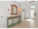 Entryway featuring a green console table and ornate mirror at 7123 Marsh View Terrace Ter, Bradenton, FL 34212