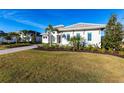 One-story home with paver driveway & lush lawn at 8497 Pavia Way, Bradenton, FL 34202