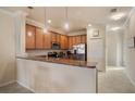 Modern kitchen with stainless steel appliances and granite countertops at 114 Babbling Brook Run, Bradenton, FL 34212