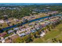 Aerial view of waterfront homes and golf course at 134 Rotonda Cir, Rotonda West, FL 33947