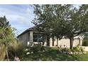 House exterior showcasing landscaping and a covered porch at 15079 Wichita Rd, Port Charlotte, FL 33981