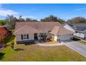 Aerial view of a single-Gathering home with a large yard and neighborhood at 207 Santarem Cir, Punta Gorda, FL 33983