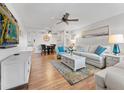 Bright living room with hardwood floors and comfy seating at 2459 Franciscan Dr # 5, Clearwater, FL 33763