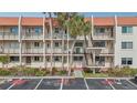 Condo building exterior showcasing multiple units and parking at 250 Santa Maria St # 120, Venice, FL 34285