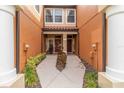 Townhome entry with walkway and lush landscaping at 284 Crew Ct, Sarasota, FL 34243