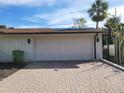 White garage door and brick paved driveway at 3455 Anglin Dr, Sarasota, FL 34242