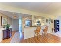 Modern kitchen with stainless steel appliances and breakfast bar at 3500 El Conquistador Pkwy # 119, Bradenton, FL 34210