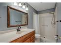 Bathroom with a shower, vanity, and a framed mirror at 3815 42Nd W Ave, Bradenton, FL 34205