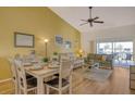 Bright dining area with a table and chairs next to the living room at 4302 Madeira Ct # 3334, Sarasota, FL 34233