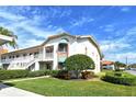 Condo building showcasing its architectural details and landscaping at 4302 Madeira Ct # 3334, Sarasota, FL 34233