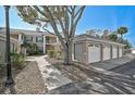 Detached garages in neutral color tones and a well-maintained community at 4705 Sand Trap Street E Cir # 105, Bradenton, FL 34203