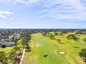 Golf course community with water views and lush landscaping at 617 Whitfield Ave, Sarasota, FL 34243