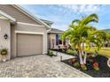 Front view of house, showing garage and walkway at 6428 Devesta Loop, Palmetto, FL 34221