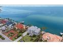 Waterfront property showcasing a beautiful home and neighboring houses at 709 Key Royale Dr, Holmes Beach, FL 34217