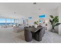 Bright dining area with ocean views and modern furniture at 709 Key Royale Dr, Holmes Beach, FL 34217