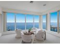 Relaxing living room with panoramic ocean views and comfy seating at 709 Key Royale Dr, Holmes Beach, FL 34217