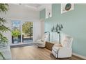 Relaxing living room with light walls, comfortable seating and patio access at 7302 Deer Crossing Ct, Sarasota, FL 34240