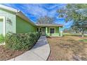 Inviting front entry with walkway and landscaping at 7930 Verna Bethany Rd, Myakka City, FL 34251