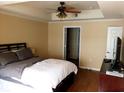 Bright bedroom with a double bed and hardwood floors at 800 S Dakota Ave # 329, Tampa, FL 33606