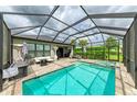 Screened pool and spa with ample patio space for entertaining at 8250 Velda Trl, Sarasota, FL 34241