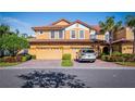 Two-story home with a two-car garage and nicely landscaped front yard at 8368 Miramar Way # 21, Lakewood Ranch, FL 34202