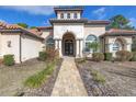 Charming home featuring a tile entryway and an elegant double-door front entrance at 9709 Wilderness Trl, Weeki Wachee, FL 34613