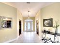 Bright and spacious entryway with tile flooring and a view into the living areas at 13609 2Nd Ne Ave, Bradenton, FL 34212