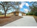 Exterior view of the house, showing the garage and driveway at 13609 2Nd Ne Ave, Bradenton, FL 34212