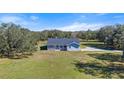 Aerial view of a ranch style home on a large lot at 13995 Mossy Hammock Ln, Myakka City, FL 34251