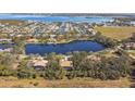 Wide shot of waterfront property with lush surroundings at 1854 Amberwynd W Cir, Palmetto, FL 34221