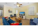 Cozy living room with blue sofa and flat-screen TV at 203 69Th St # A, Holmes Beach, FL 34217