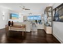 Bright living room featuring sleek ceiling fans, modern decor, and stunning water views at 3060 Grand Bay Blvd # 124, Longboat Key, FL 34228