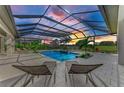 Enjoy this relaxing pool and patio area with covered lanai at 3123 Founders Club Dr, Sarasota, FL 34240