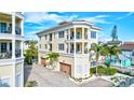 Three-story house with balconies and attached garage, near beach at 317 Beach Rd, Sarasota, FL 34242