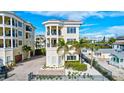 Three-story house with balconies, a private driveway, and a pool at 317 Beach Rd, Sarasota, FL 34242