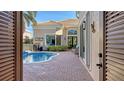 Private pool and patio with lush landscaping at 3598 Fair Oaks Ln, Longboat Key, FL 34228