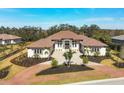 Luxury home with tile roof and landscaped grounds at 3927 Founders Club Dr, Sarasota, FL 34240