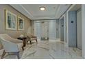 Lobby with seating area and marble floors at 401 N Point Rd # 401, Osprey, FL 34229