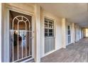 Condo hallway with tiled floors and access to unit at 4350 Chatham Dr # E106, Longboat Key, FL 34228