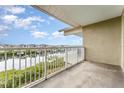 Balcony with white railings overlooking waterway with waterfront views and homes in the distance at 559 Bahia Beach Blvd, Ruskin, FL 33570